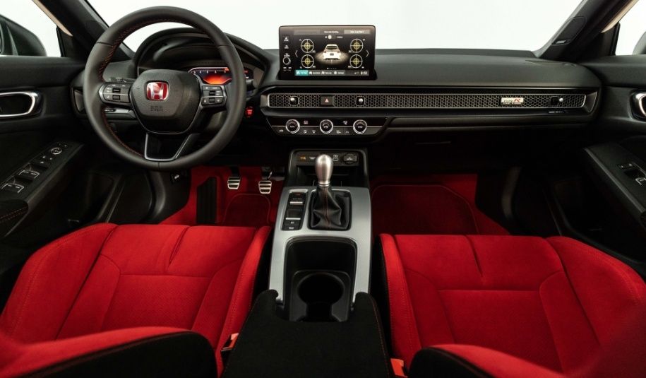 Honda Civic Type R sporty interior with red performance seats and driver-focused cockpit design