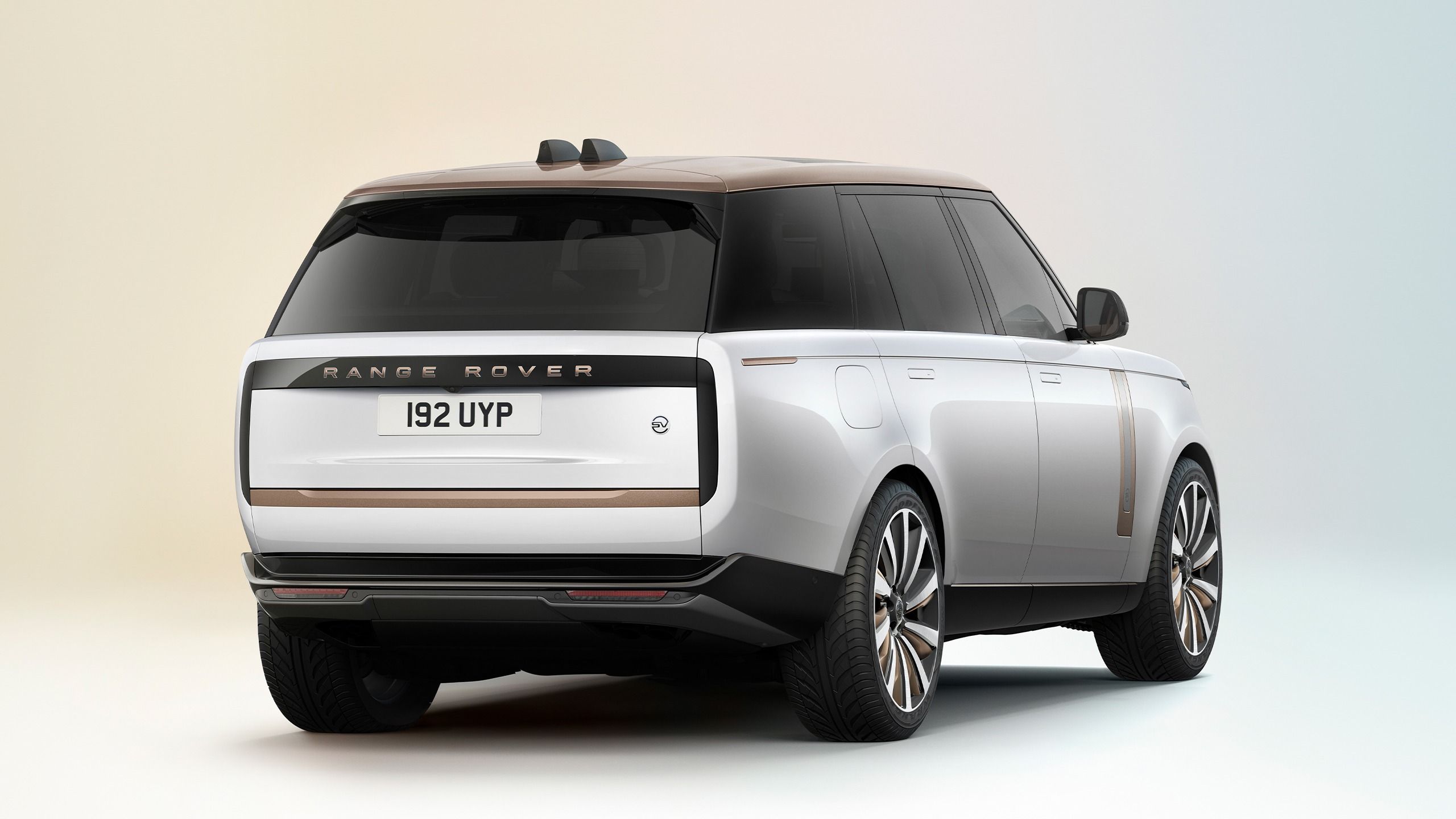 Rear three-quarter view of the 2027 Range Rover Electric showcasing redesigned tailgate and EV badging