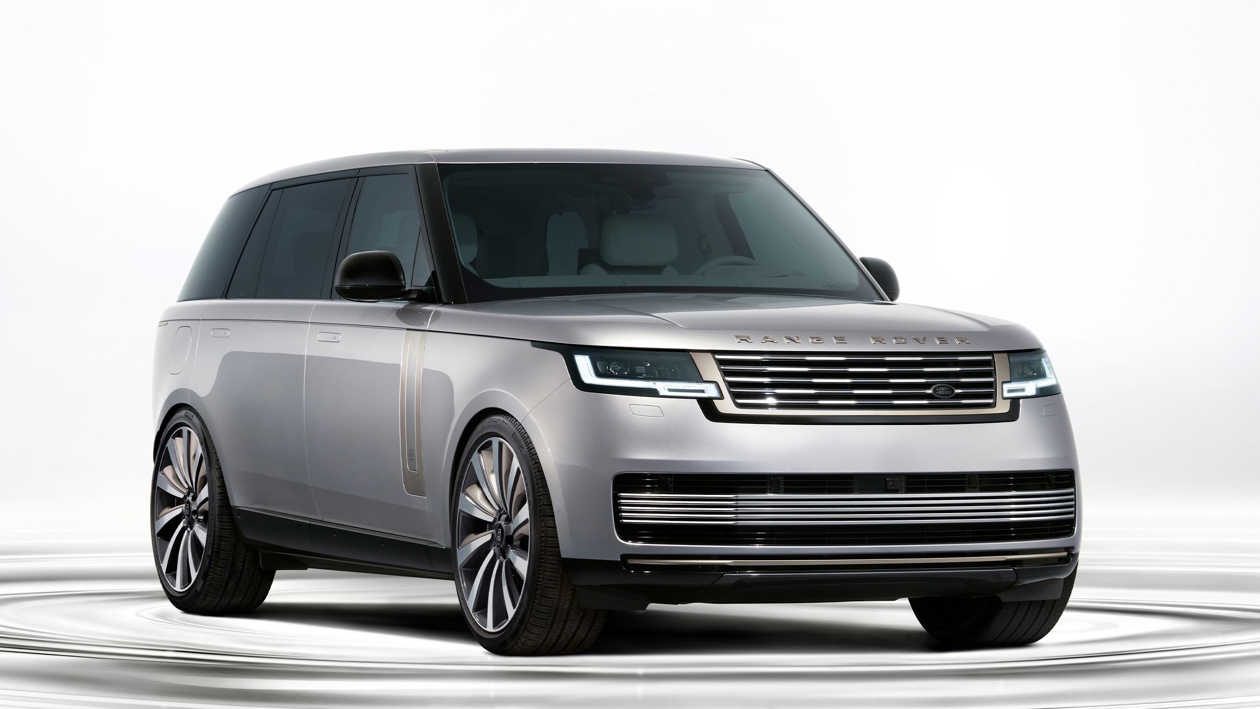 Front three-quarter view of the 2027 Range Rover Electric in silver finish with aerodynamic design