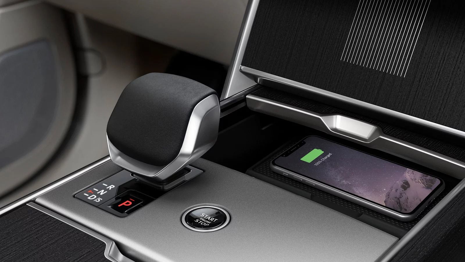 2027 Range Rover center console with electronic gear selector and wireless smartphone charging pad