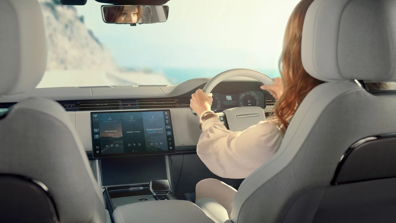 Driver-focused dashboard of the 2027 Range Rover featuring Pivi Pro infotainment system and digital instrument cluster