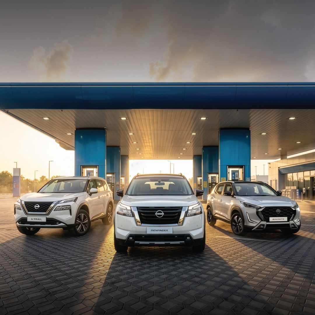 Nissan SUV lineup including Magnite, X-Trail, and Pathfinder driving through a modern city with promotional fleet offer branding.