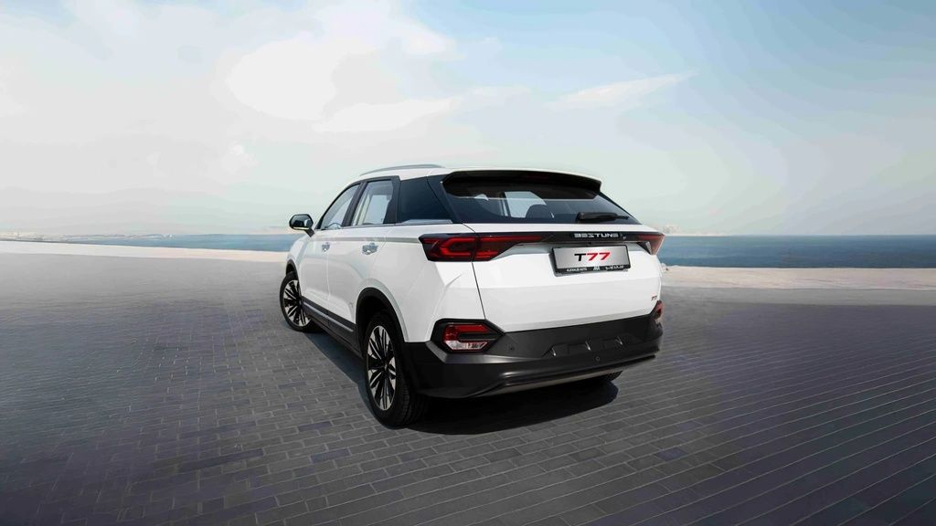 Bestune T77 rear three-quarter view showcasing sleek styling and LED taillights.