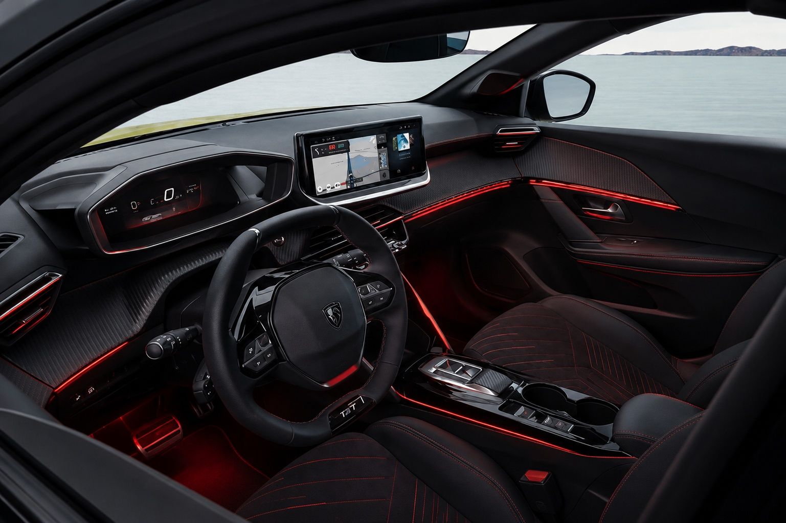 Alt Text: Peugeot E-208 interior featuring red ambient lighting, digital cockpit, and premium cabin design.