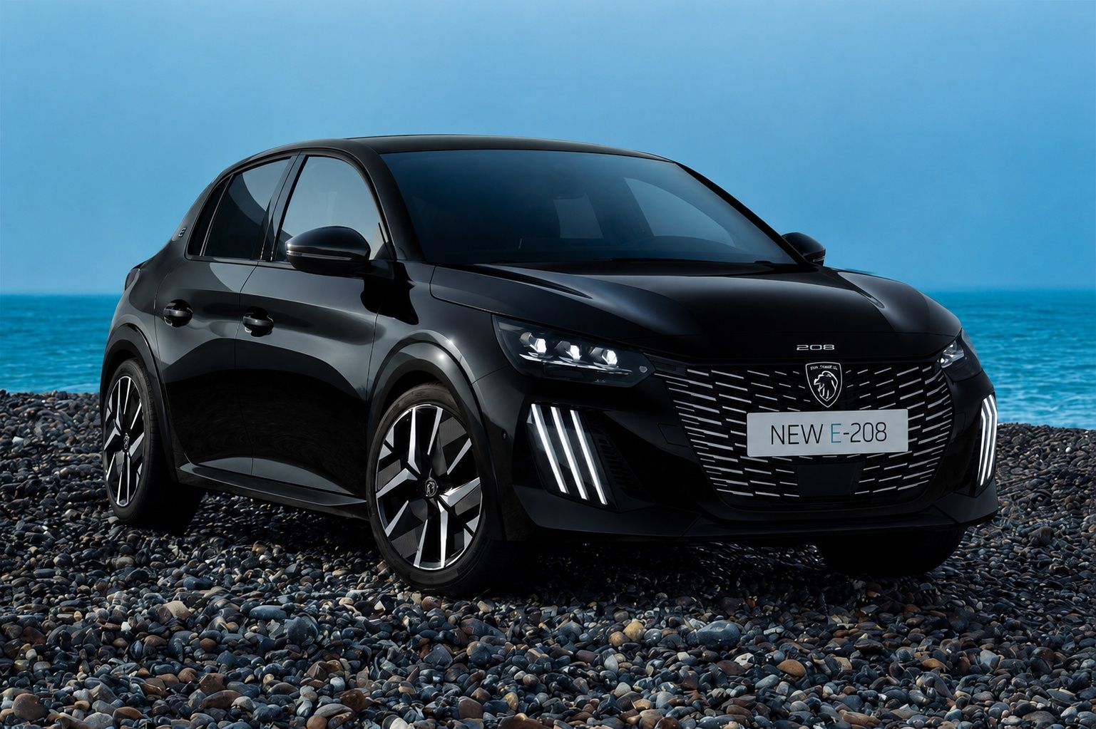 Black Peugeot E-208 with sporty styling and modern electric design.