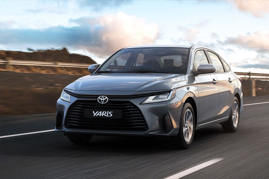 2026 Toyota Yaris sedan driving on the road with modern styling