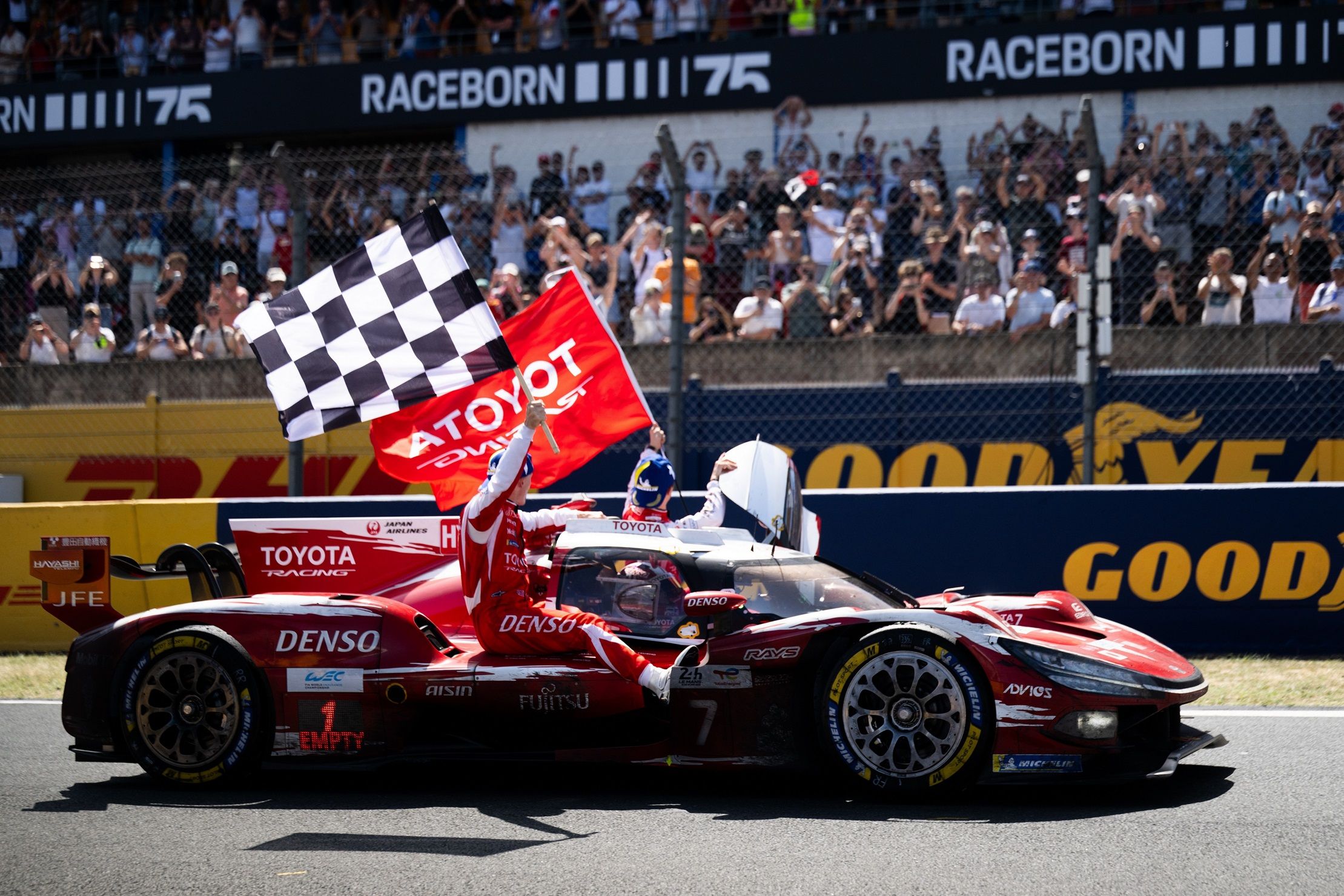 The victorious No. 7 Toyota TR010 Hybrid crosses the finish area as TOYOTA RACING celebrates its sixth Le Mans victory.