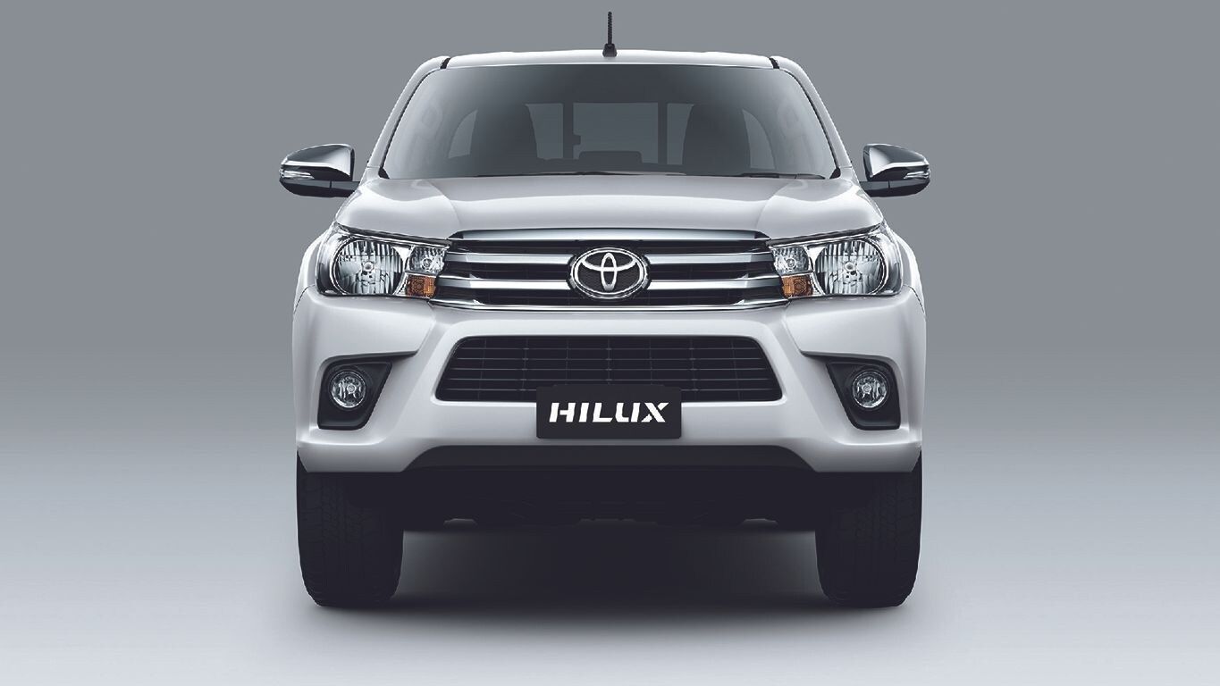 Toyota Hilux front view highlighting its bold grille and rugged pickup design.