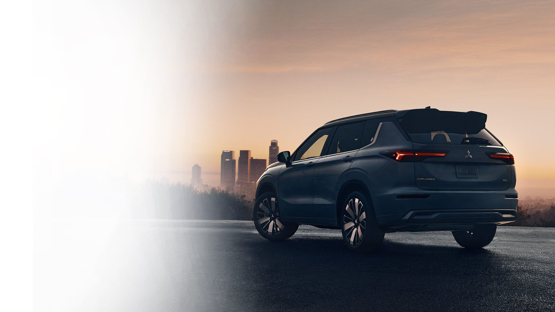 Mitsubishi Outlander rear view at sunset