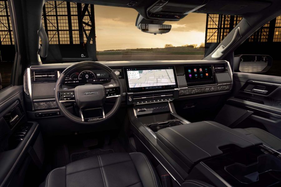The dashboard of the 2027 GMC Sierra Denali Ultimate with a large digital instrument cluster, infotainment display and redesigned centre console.