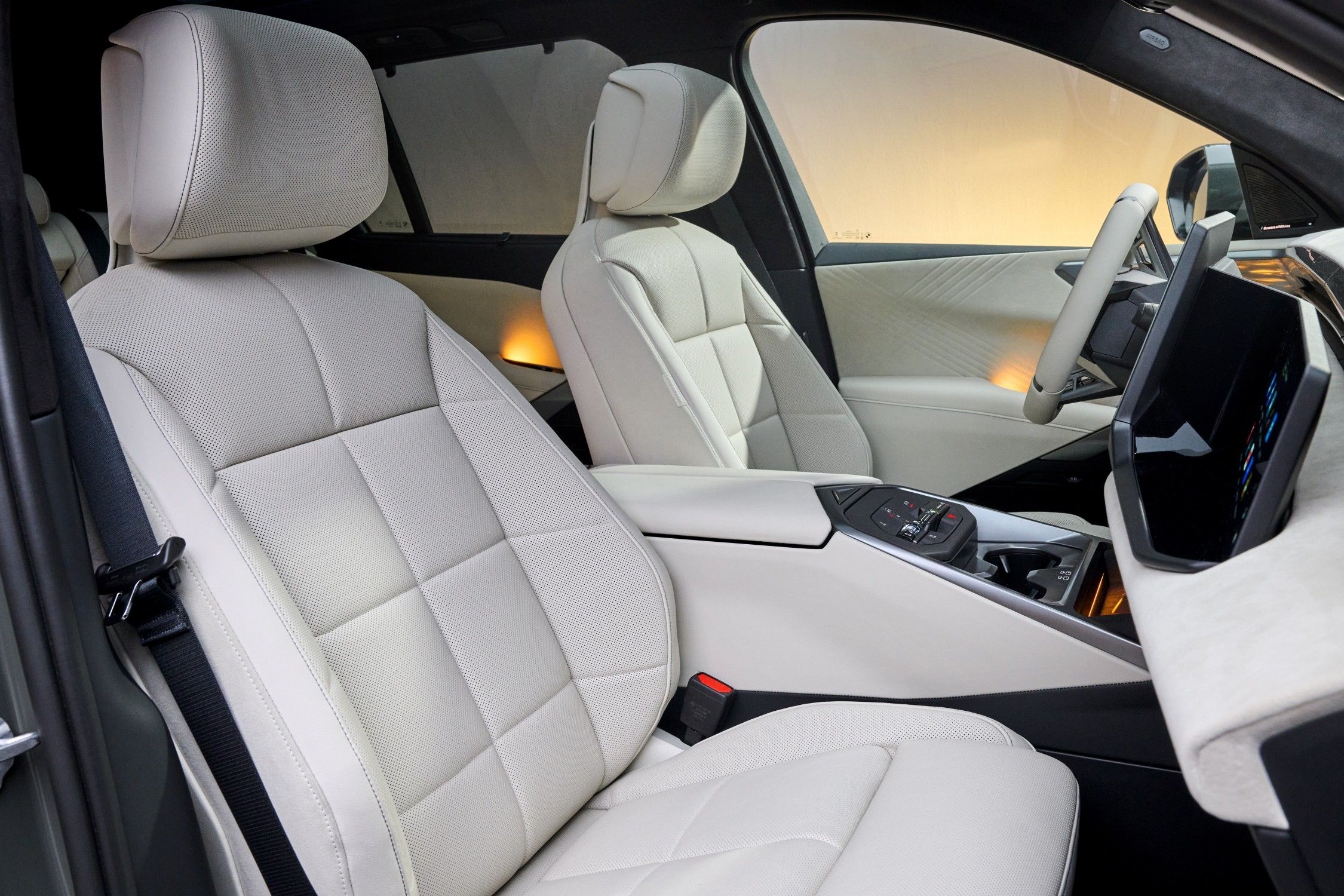 Front seats of the new BMW X5 featuring premium upholstery, ambient lighting and a minimalist cabin design.