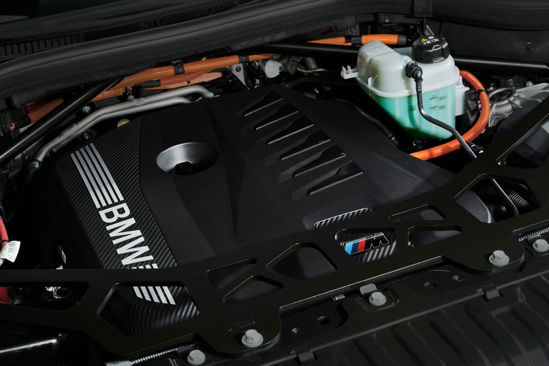 Engine bay of the BMW X5 plug-in hybrid showcasing the electrified powertrain components.