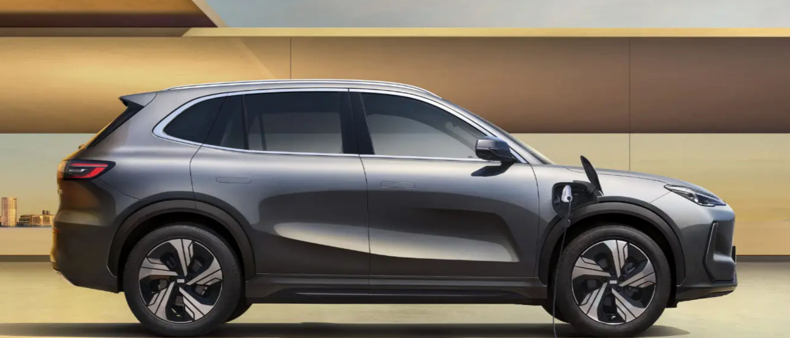 Geely EX5 side profile showcasing its sleek electric SUV design and charging port