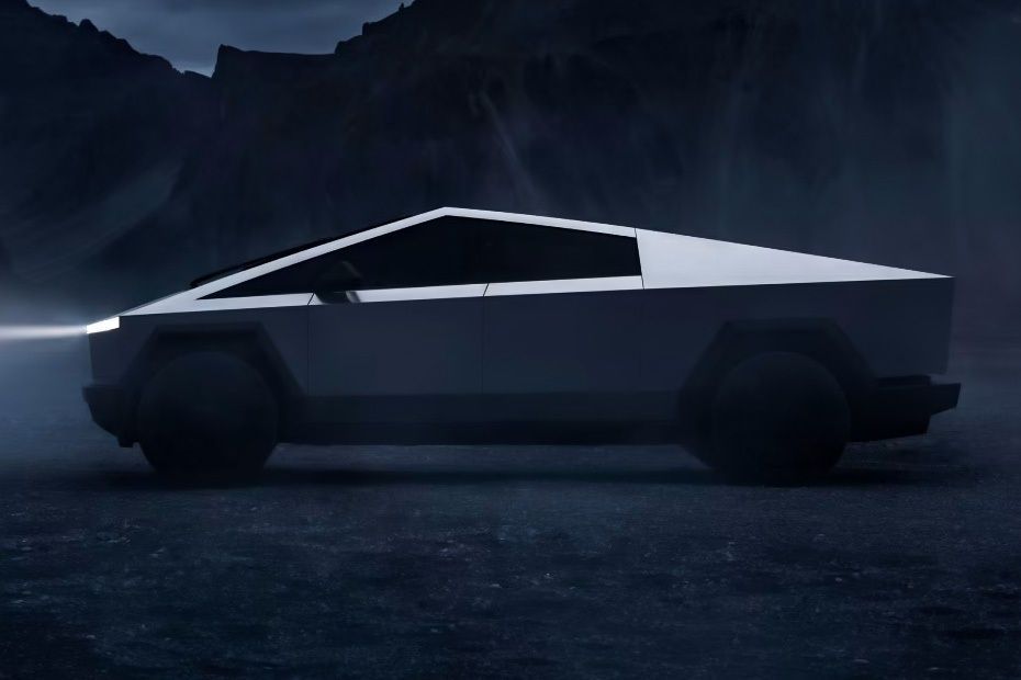 Tesla Cybertruck side profile highlighting its stainless steel body and angular design