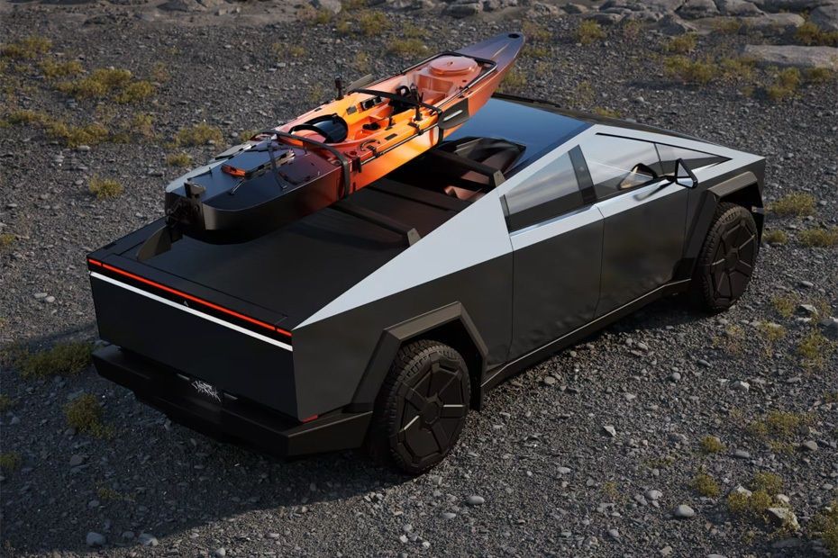Tesla Cybertruck rear view showcasing cargo bed carrying a kayak and outdoor gear