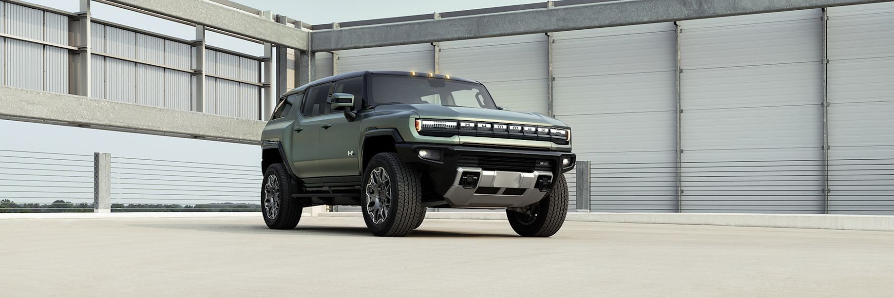 GMC Hummer EV SUV parked showcasing rugged exterior design and off-road styling