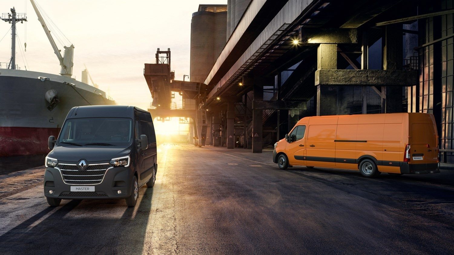 Renault Master commercial vans at an industrial loading facility