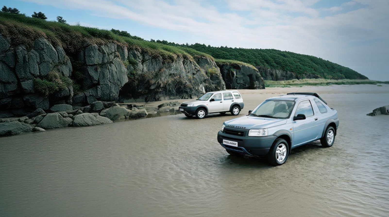 Classic Land Rover Freelander models on the beach