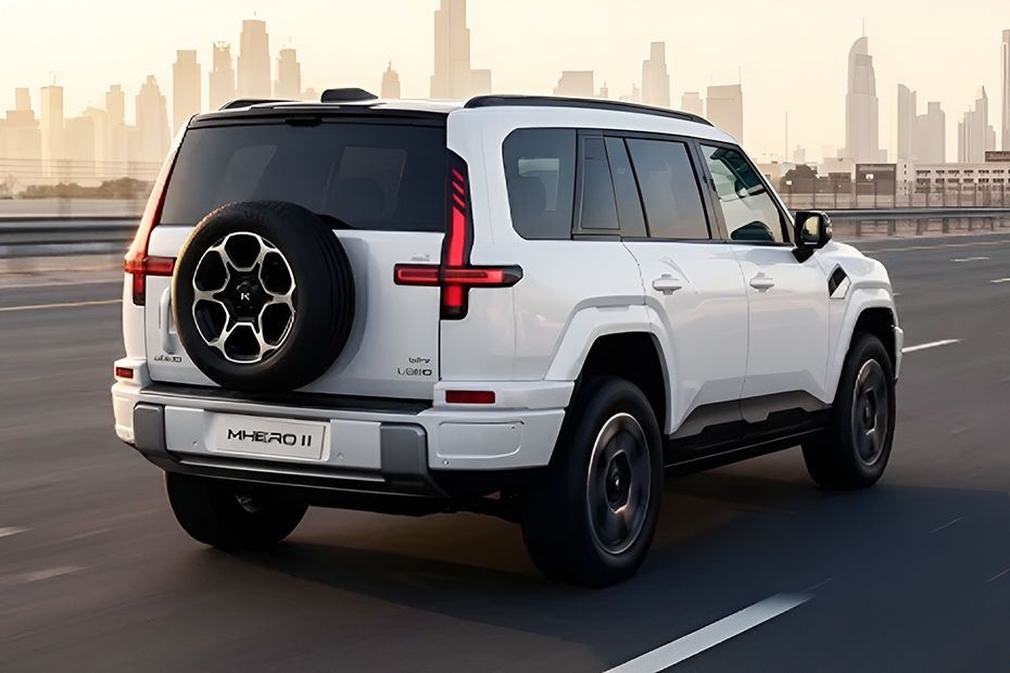 MHERO 2 rear three-quarter view showcasing spare wheel and LED taillights on a city road