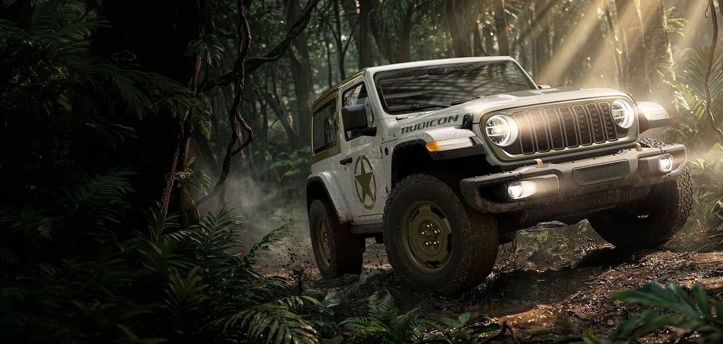 Jeep Wrangler Sarge driving through a forest trail