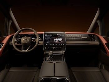 GAC M8 interior featuring a premium dashboard with a large touchscreen infotainment system and multifunction steering wheel.