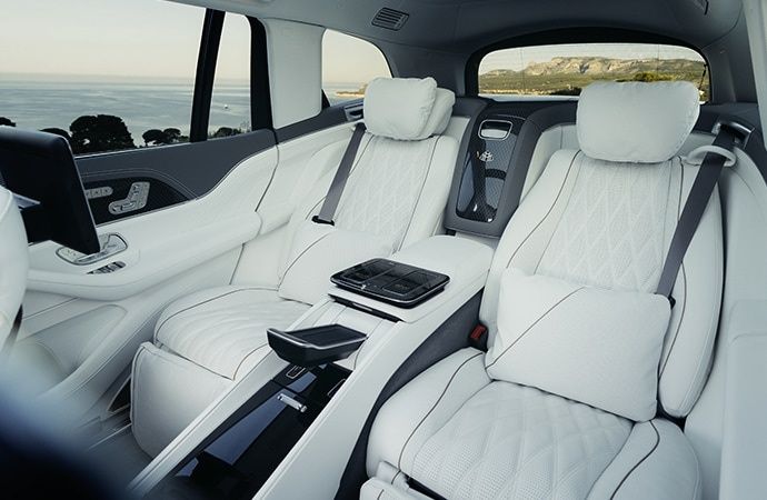 Mercedes-Maybach GLS 680 rear executive seats with white leather upholstery.