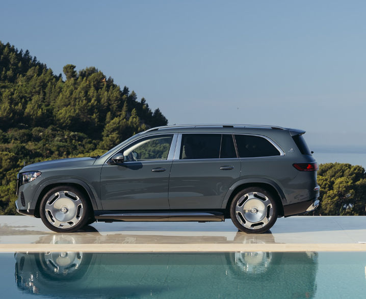 Mercedes-Maybach GLS 680 side profile parked by the waterfront.