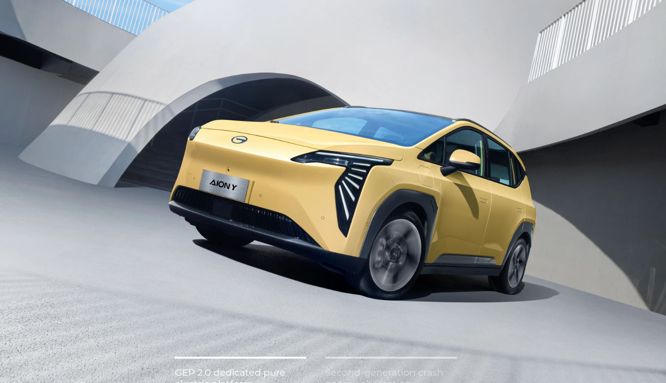 Yellow AION Y Plus rear three-quarter exterior view.