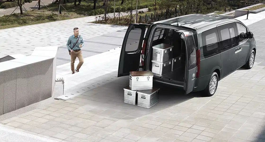 Hyundai STARIA cargo area with the rear doors open, highlighting its practical luggage space.