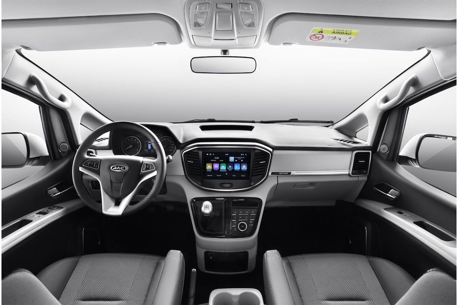 JAC M4 dashboard featuring a multifunction steering wheel and touchscreen infotainment system.