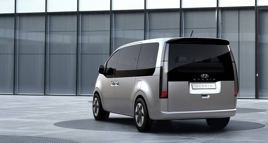 Rear three-quarter view of the Hyundai STARIA showcasing its modern LED lighting and clean design.
