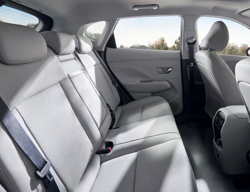 Hyundai Kona Electric rear seats with spacious cabin, premium upholstery, and rear AC vents.