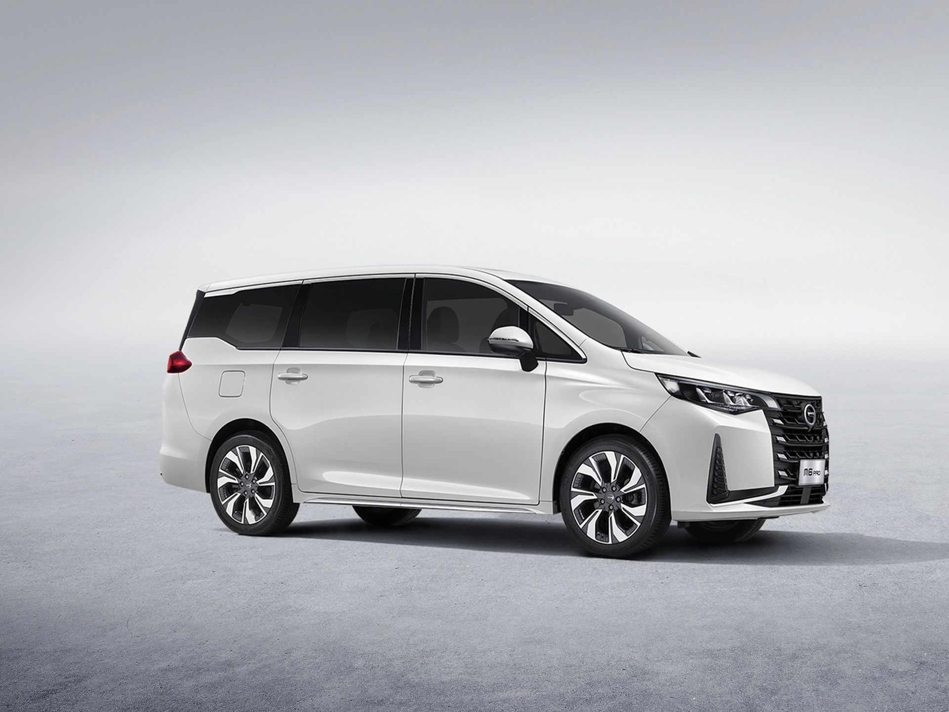 GAC M6 Pro showcasing its modern MPV design with a sleek side profile and alloy wheels.
