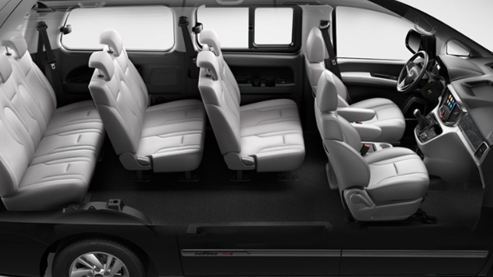 JAC M4 9-seater cabin with three-row seating and spacious interior for passengers.