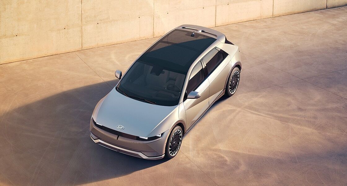 Hyundai IONIQ 5 top view showcasing the panoramic glass roof and futuristic electric SUV design