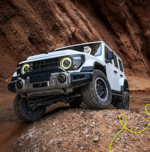 2027 212 T01 Navigator driving on an off-road trail in the desert