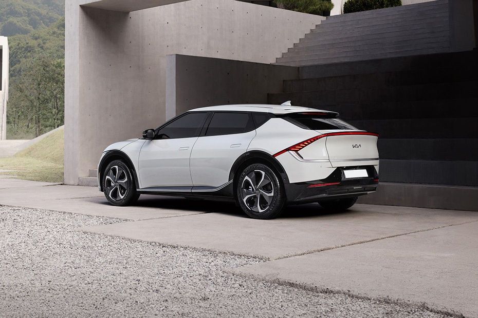 Kia EV6 rear three-quarter view parked outside a modern building