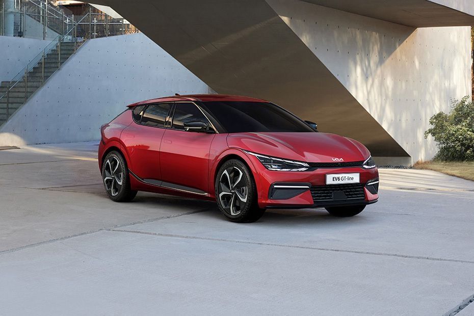 Red Kia EV6 GT-Line parked outside a modern building