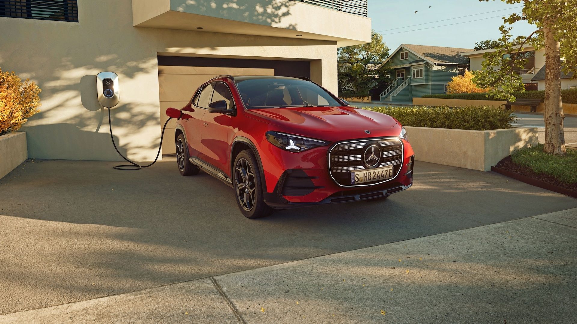 Mercedes-Benz GLA charging at a home wallbox, showcasing its electric-first powertrain