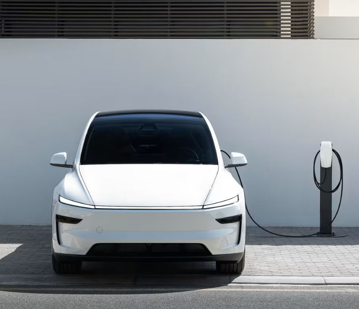 Tesla Model Y charging at a public EV charging station