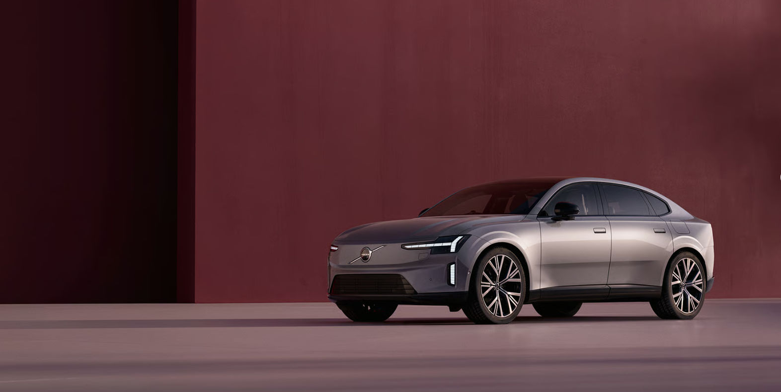 Volvo ES90 electric sedan in a front three-quarter studio view
