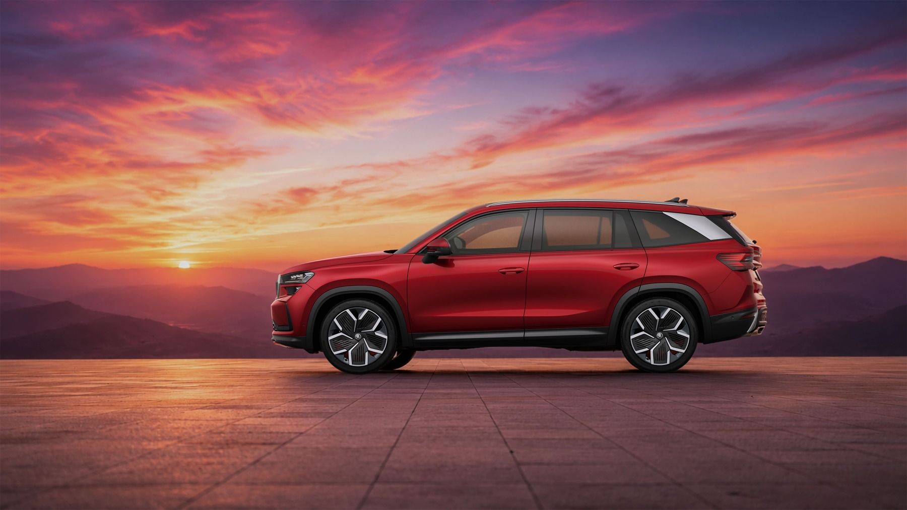 Skoda Kodiaq 2026 red SUV side profile with alloy wheels and roof rails