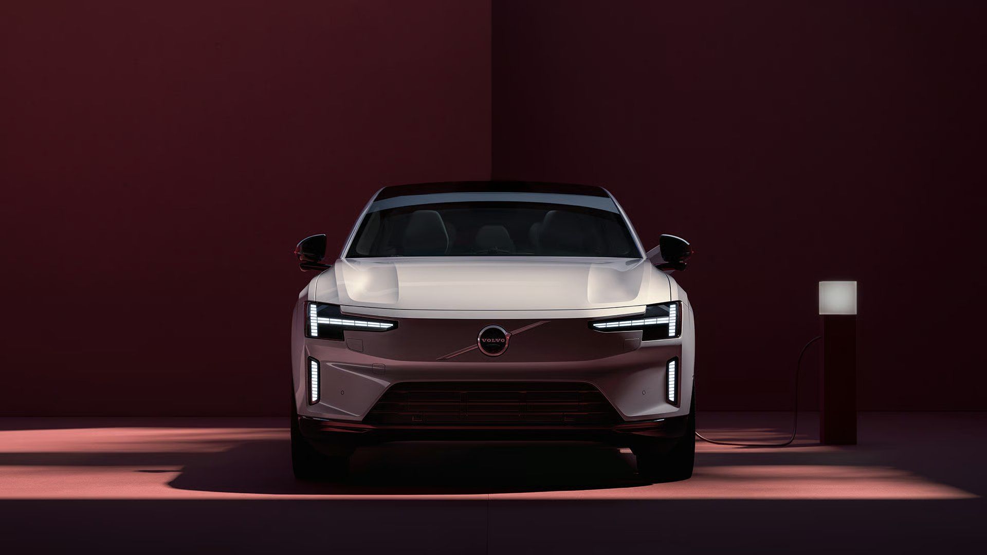 Volvo ES90 front view with distinctive LED headlights.