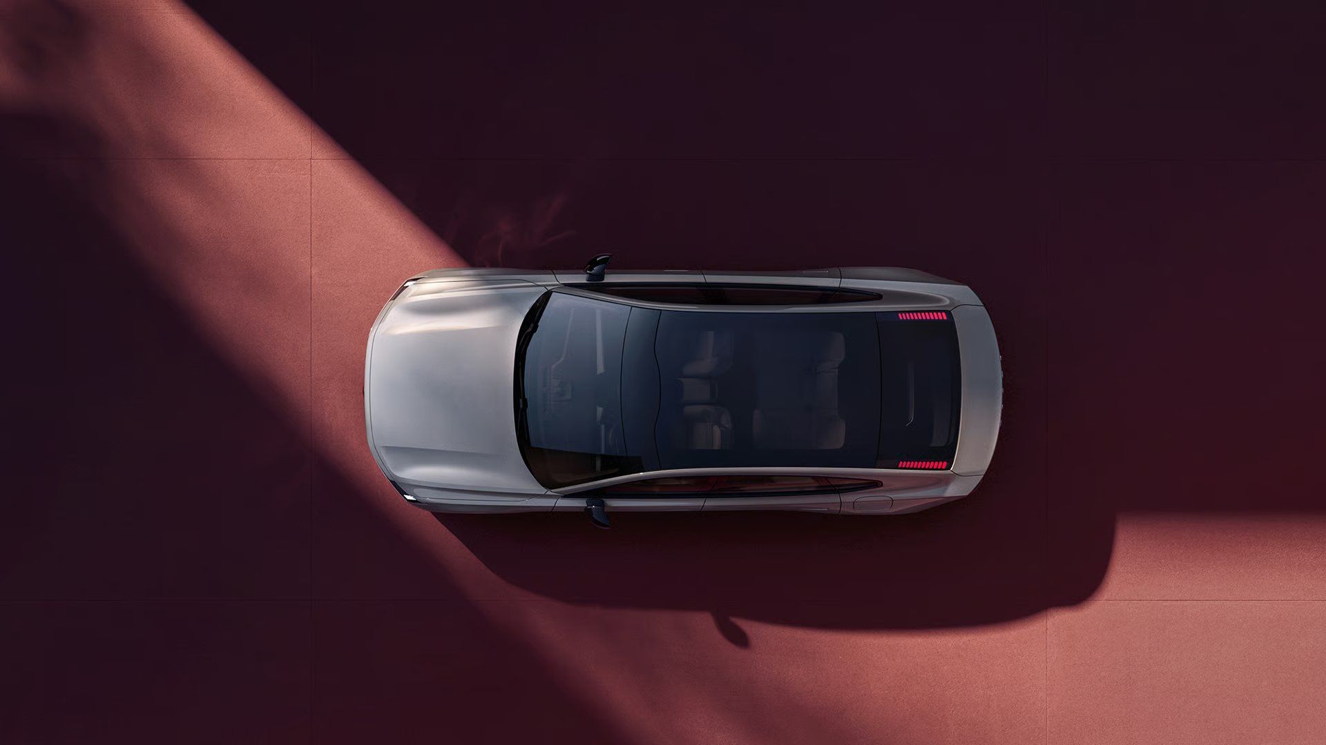 Volvo ES90 top view showcasing its panoramic roof.