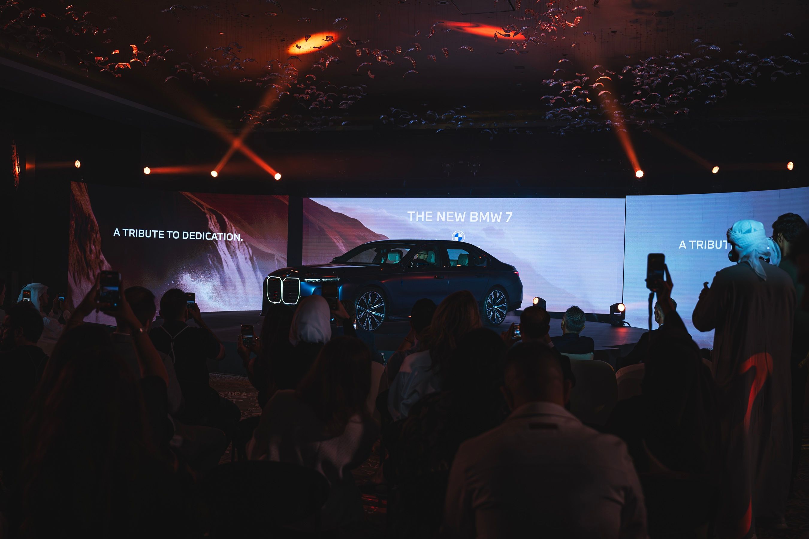 Audience watches the new BMW 7 Series reveal at a Dubai launch event