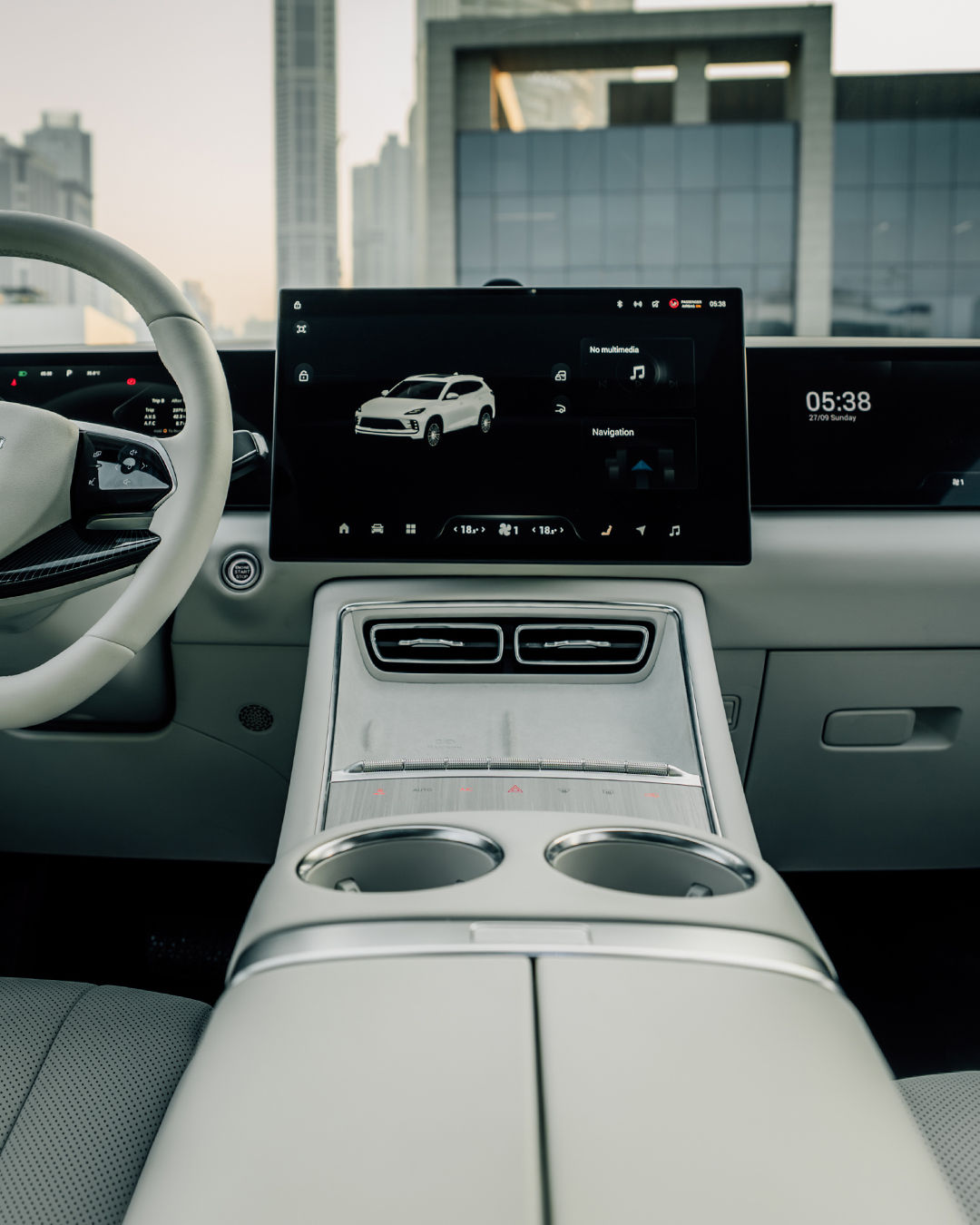EXEED MX interior with 15.6-inch central touchscreen, digital instrument cluster and beige dashboard