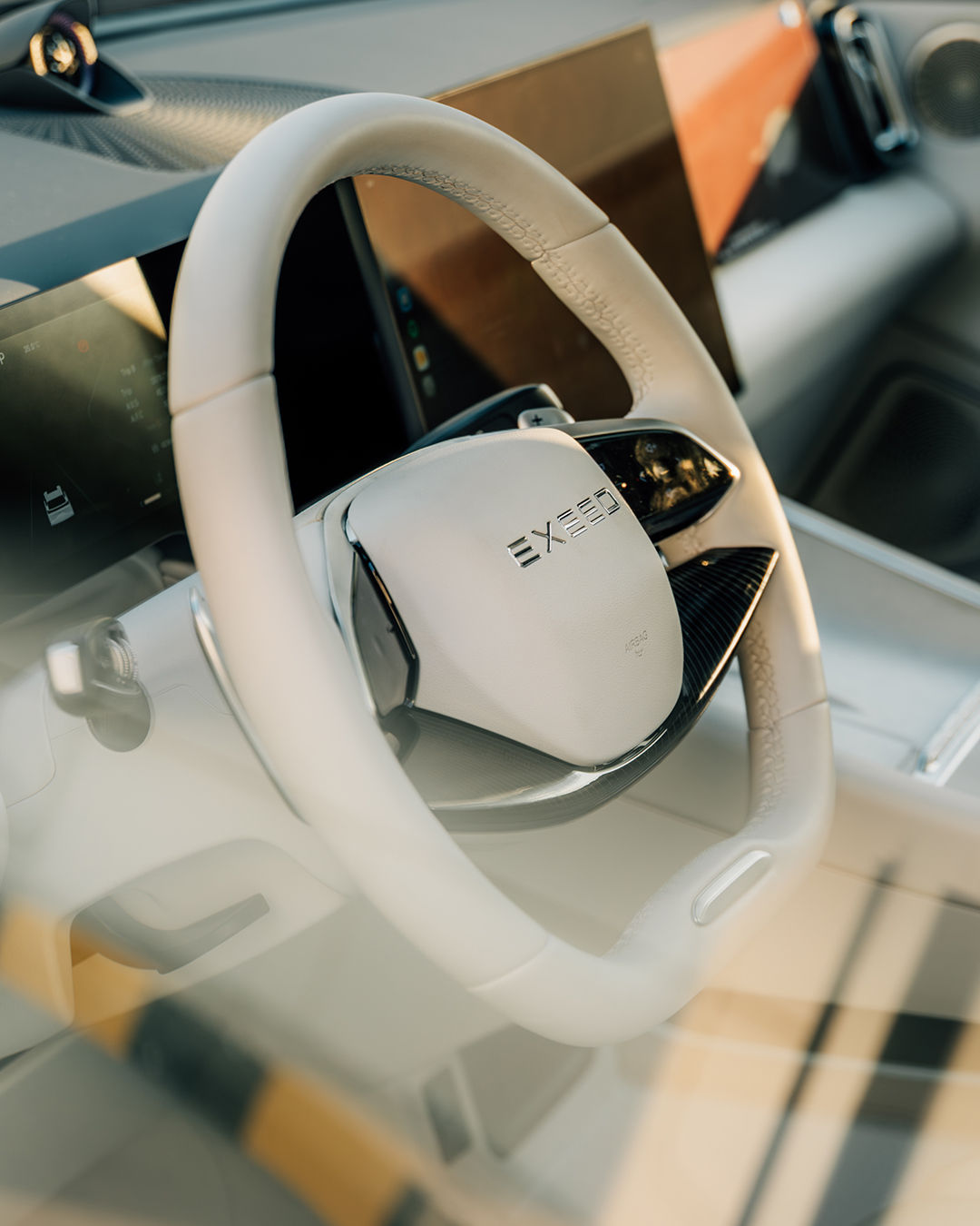 EXEED MX cabin featuring a leather-wrapped steering wheel and digital driver display