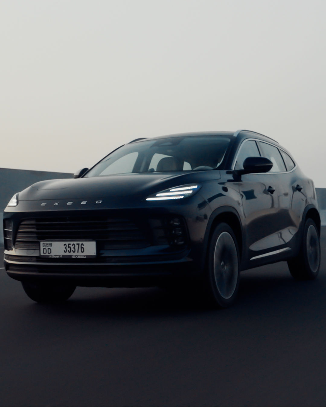 EXEED MX SUV showcased at a Dubai automotive event, highlighting its exterior design and styling.